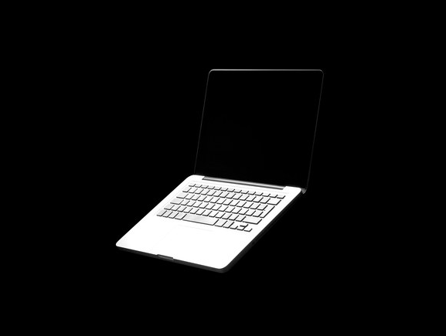 black background white laptop